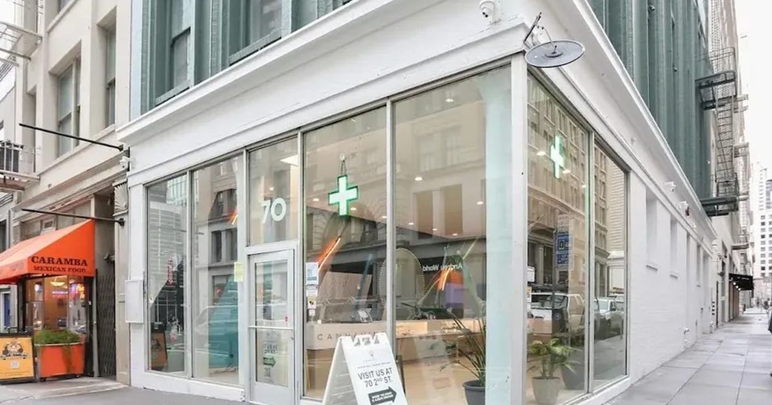 Cannavine cannabis dispensary storefront with green cross sign in San Francisco